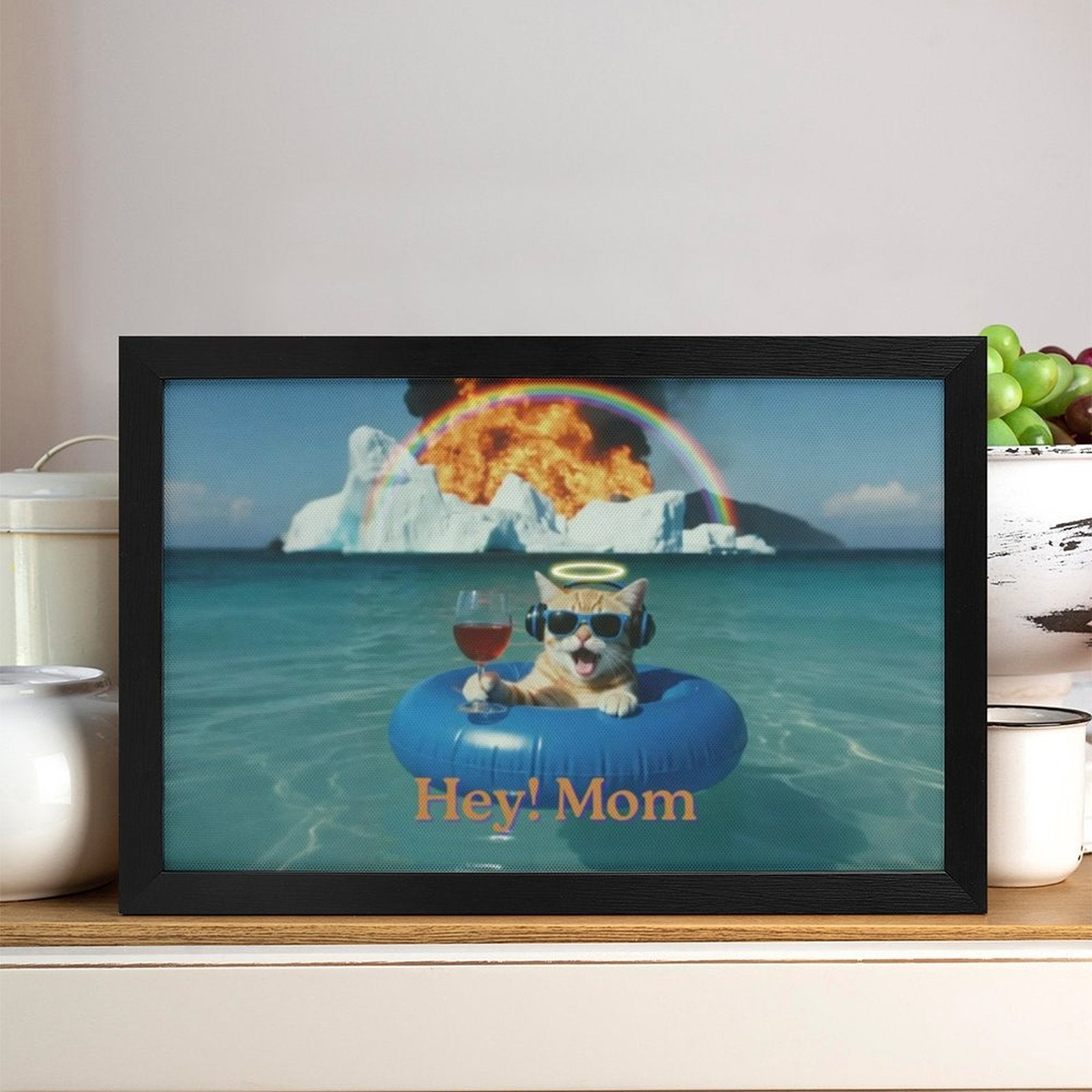 Framed picture of a cat on an inner tube with a humorous scene, placed on a shelf.